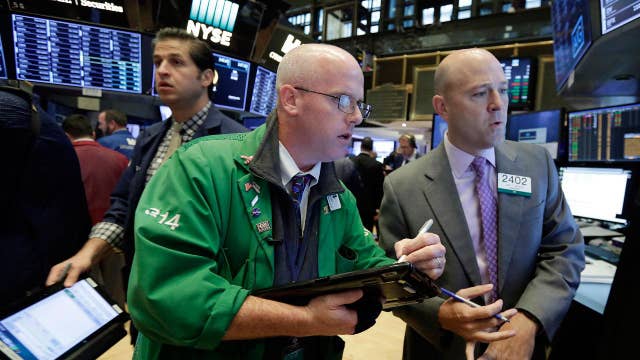 Stocks posts record close on tax reform hopes