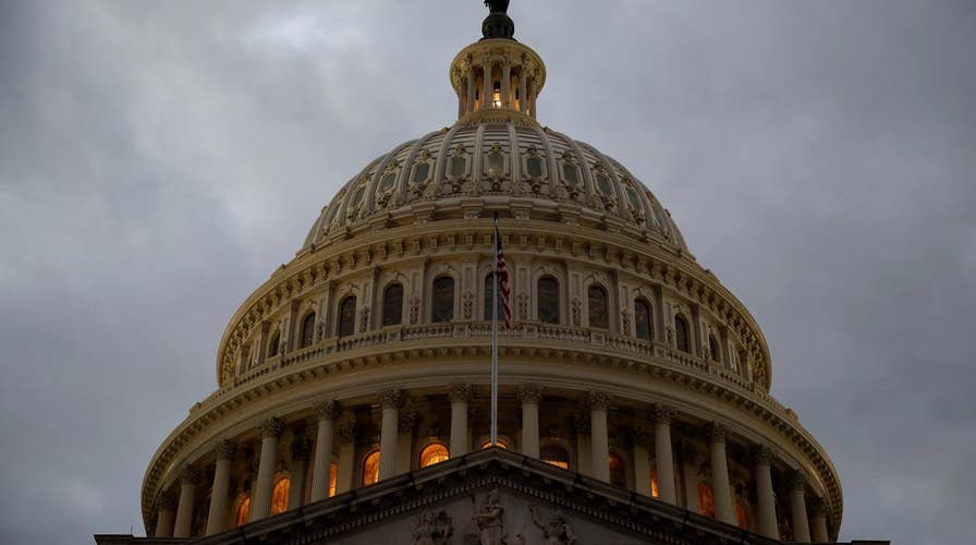 Stocks slide as Congress debates new spending bill