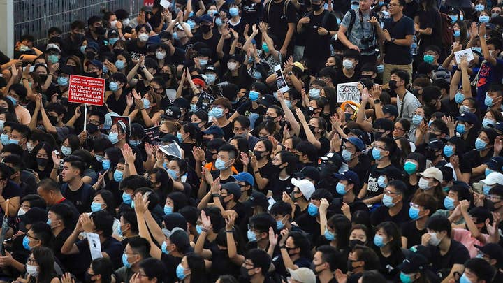 China threatens to use force in Hong Kong