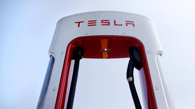 Tesla stock rises as China exempts company’s electric cars from auto tax