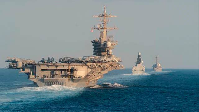 China warns US to stop ‘flexing muscles’ in South China Sea 