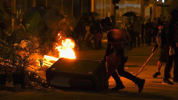 Hong Kong violence continues: Police storm university, threaten to use live rounds