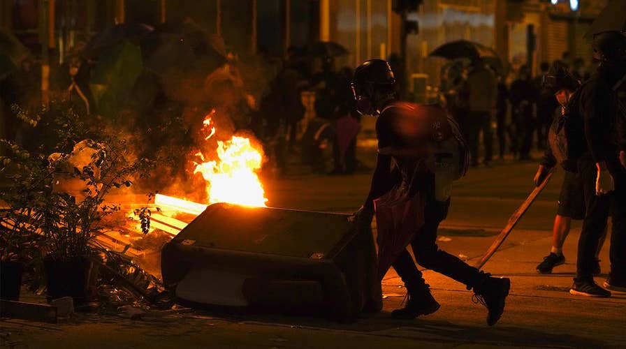 Hong Kong violence continues: Police storm university, threaten to use live rounds