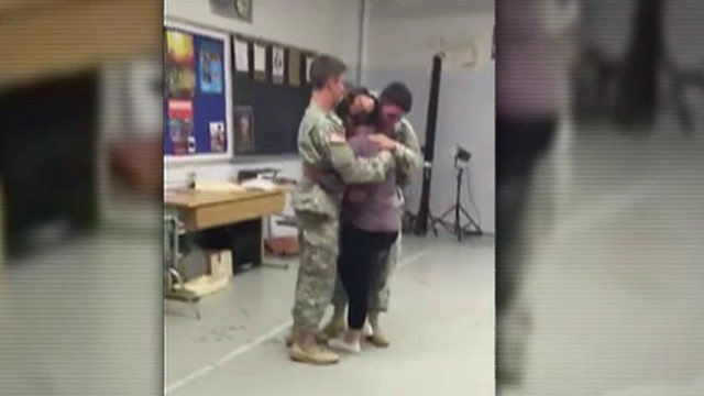 Military brothers surprise sister at high school