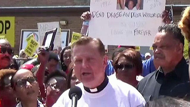 Father Pfleger's NRA protest sparks gun rights debate