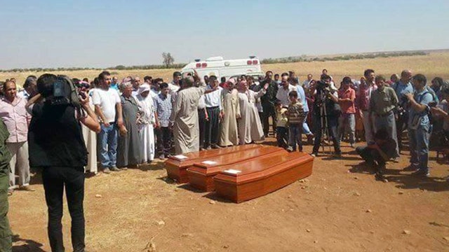 Drowned Syrian boy and family buried in hometown