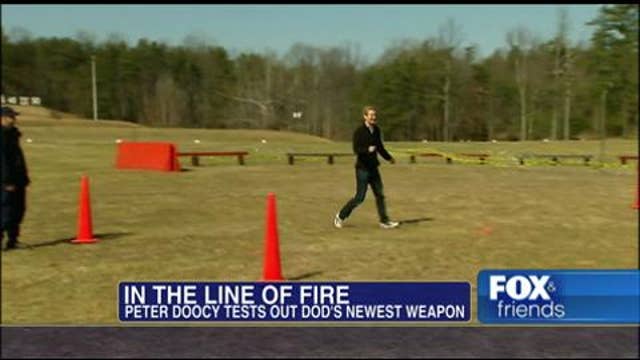 Peter Doocy Tests Out the Military’s New Crowd Controlling Weapon