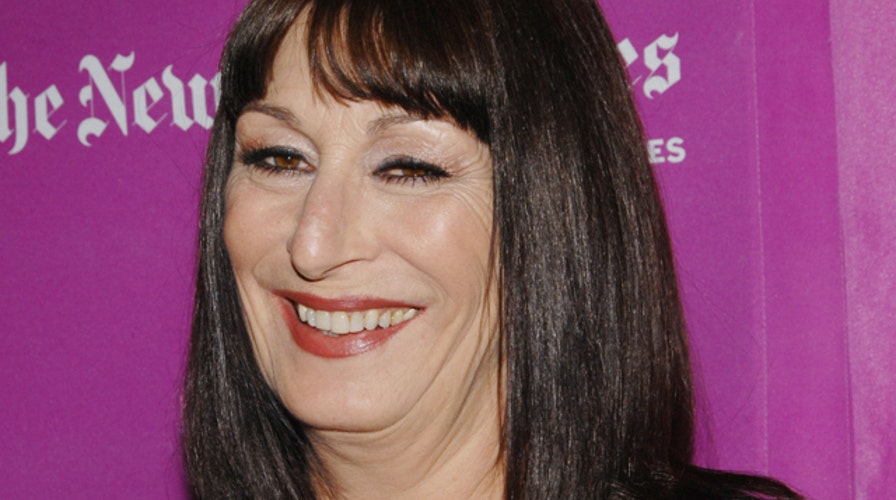 What Does Anjelica Huston Sing in the Shower?