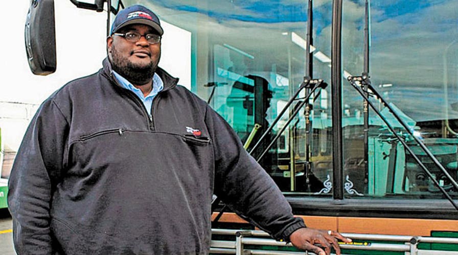 Bus driver hero talks woman off bridge