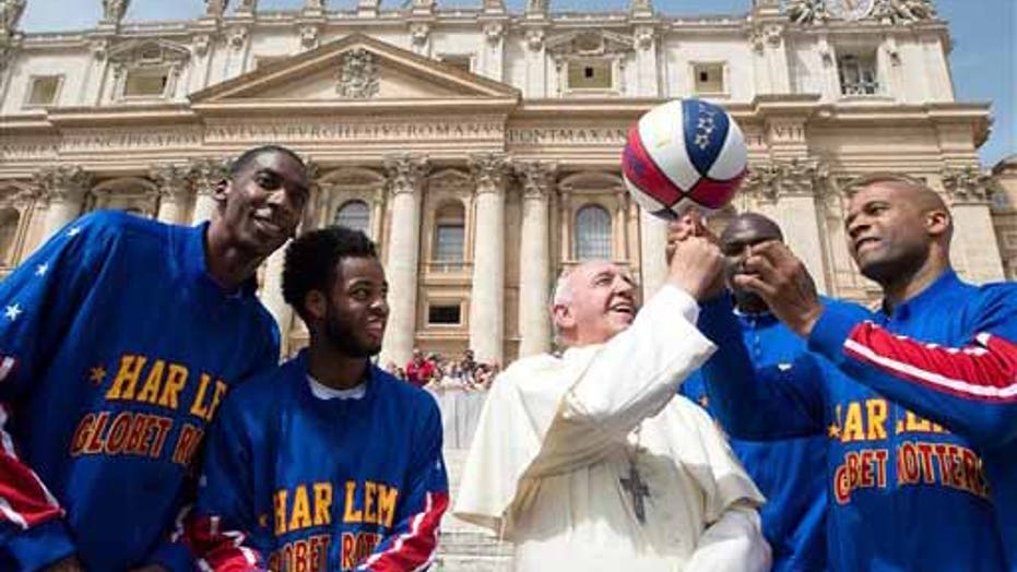 Pope Francis learns some basketball tricks from Harlem Globetrotters