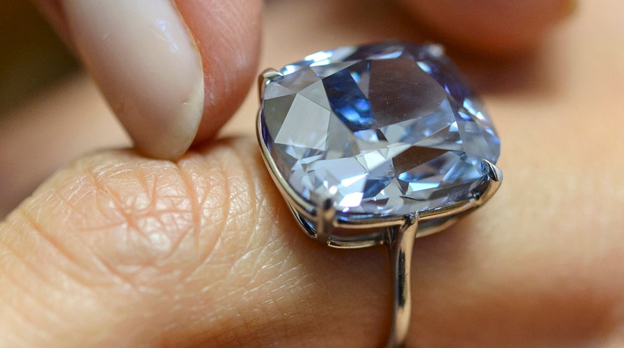 Rare 'Blue Moon' diamond sells for record $48.5 million