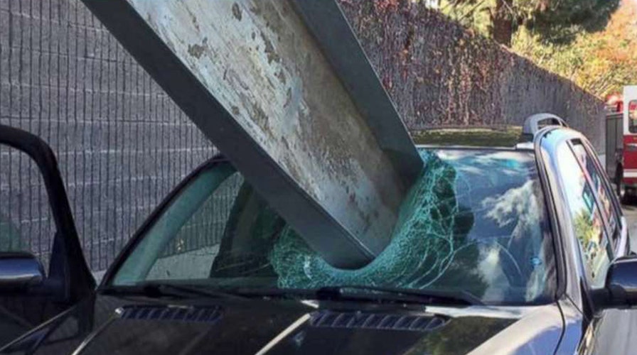 Massive I-beam impales car, just misses driver