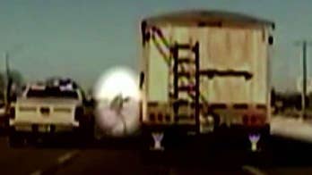 Caught on video: Nebraska deputy jumps into moving truck to prevent crash