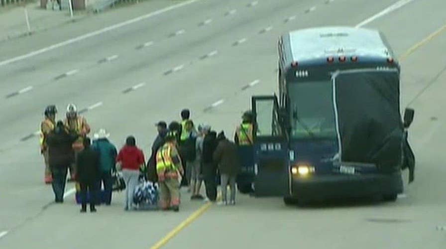 Greyhound bus slams into stalled car killing one woman