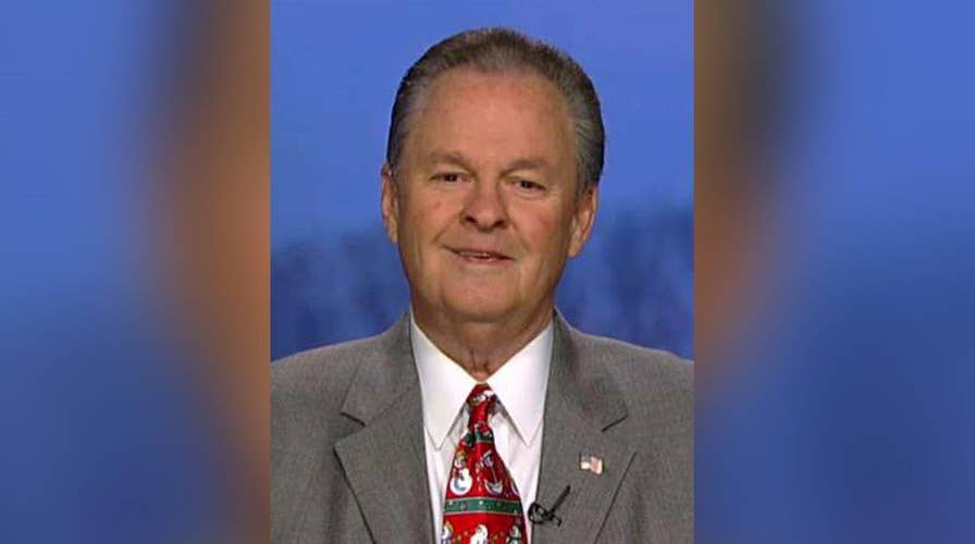 Who is the man behind Carly Fiorina?