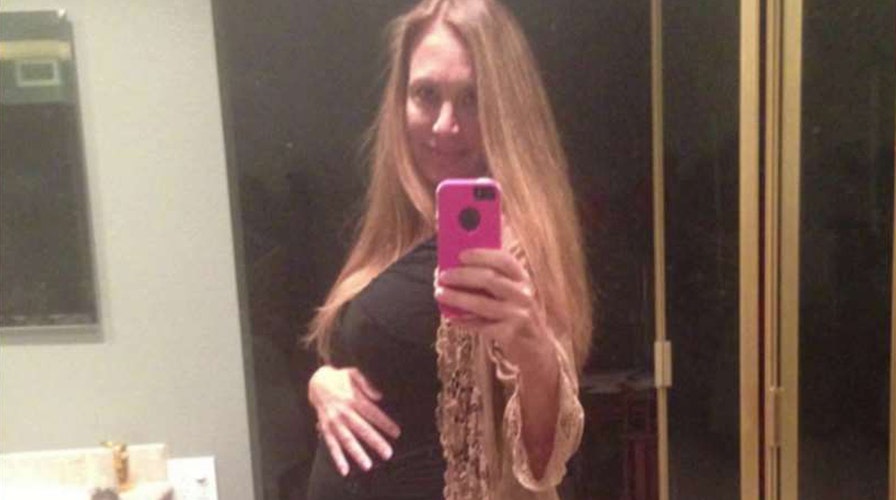 Surrogate mother carrying triplets sues to stop abortion