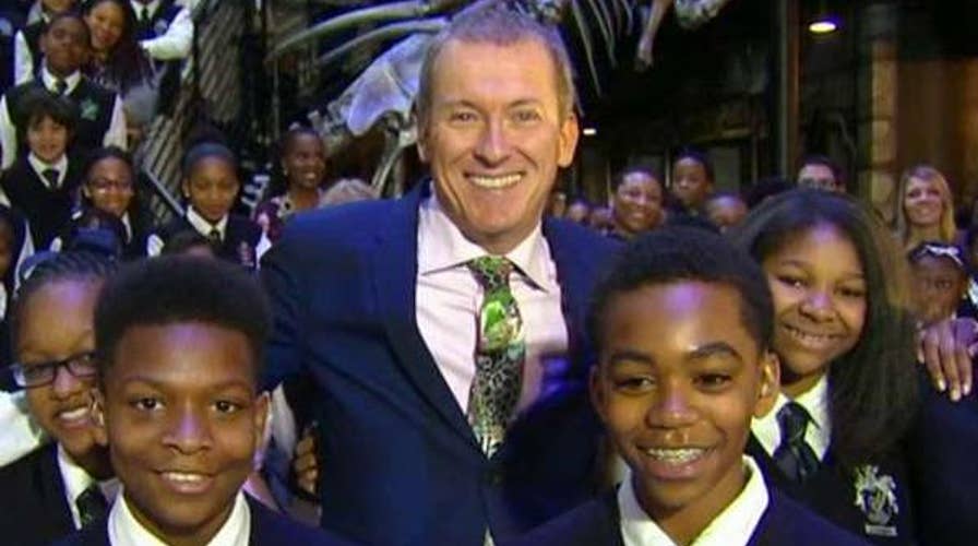 Teacher shows off his slick dance moves with students