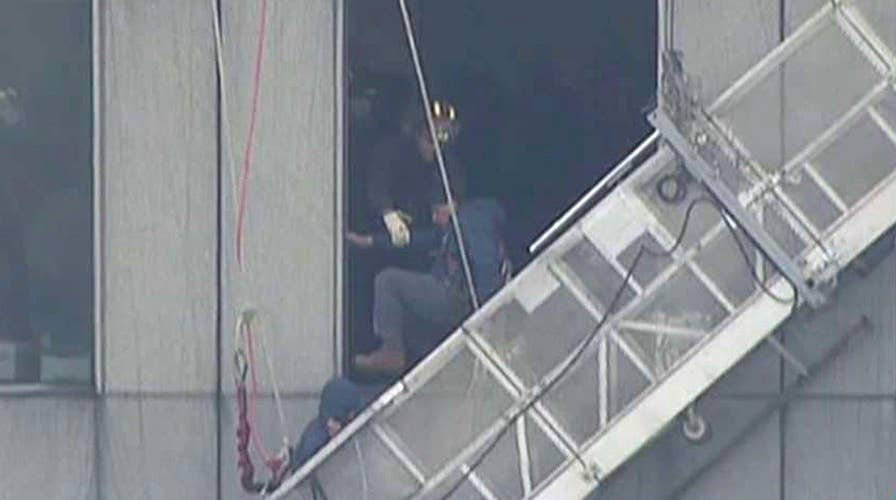 Firefighters save window washers trapped on broken scaffold