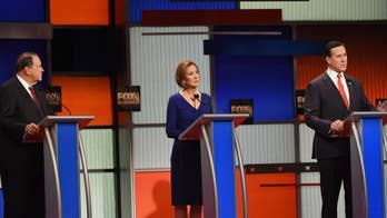 Obama policies under fire at GOP evening debate, Huckabee calls gun rules 'insane'