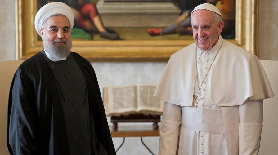 Iranian president meets with business leaders, pope in Italy