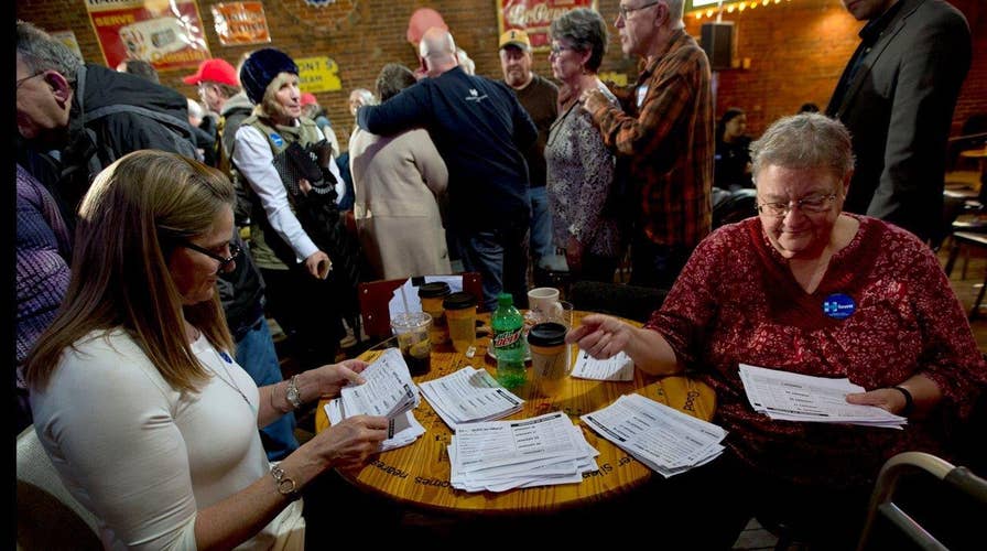 Many Iowa voters still undecided in fluid caucus race