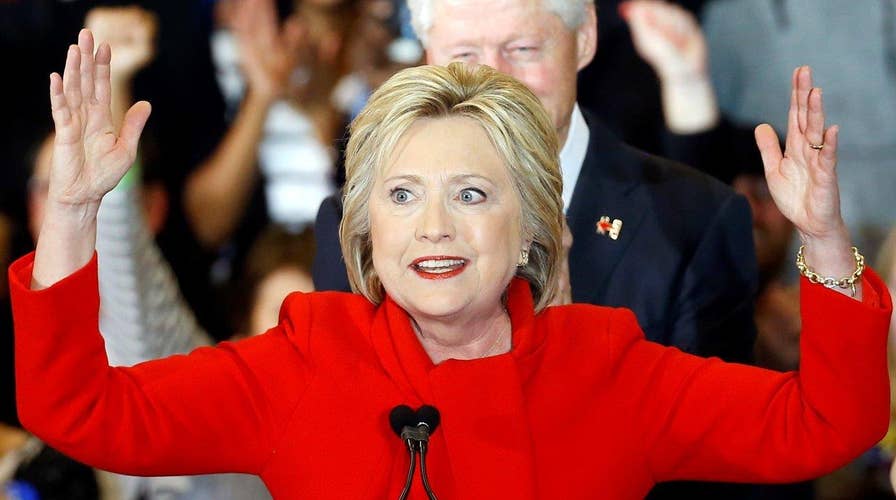 Hillary Clinton claims victory in Iowa after tight race