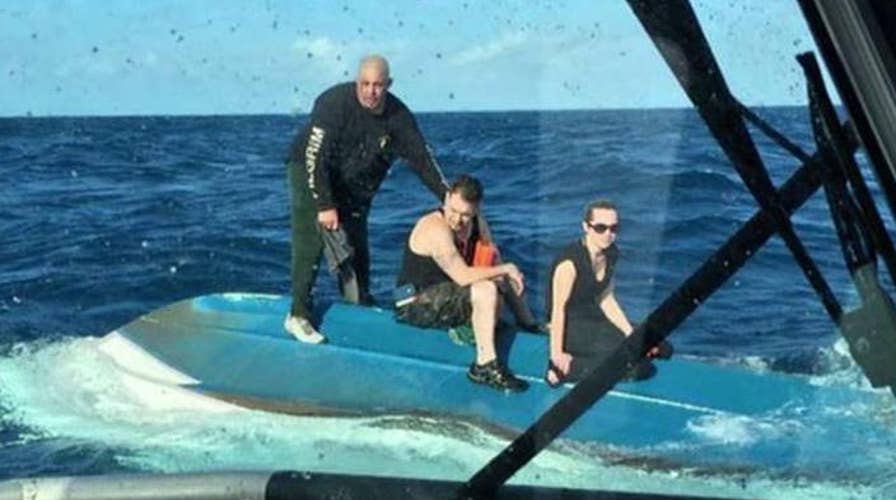 Coast Guard saves three after boat capsizes