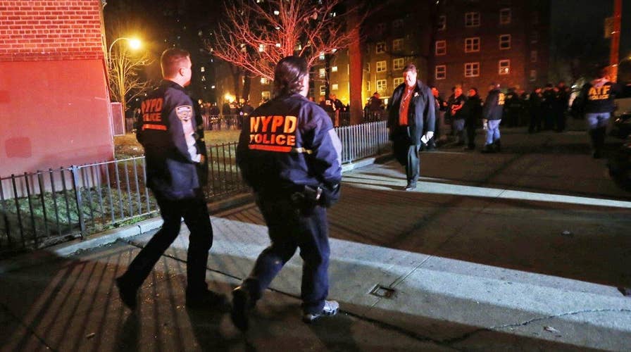 Investigators look for motive in shooting of two NYPD cops