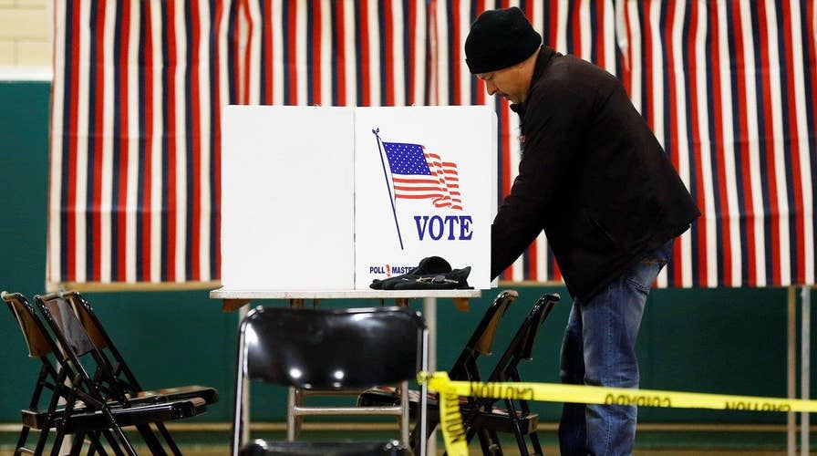 New Hampshire voters head to polls for first primary