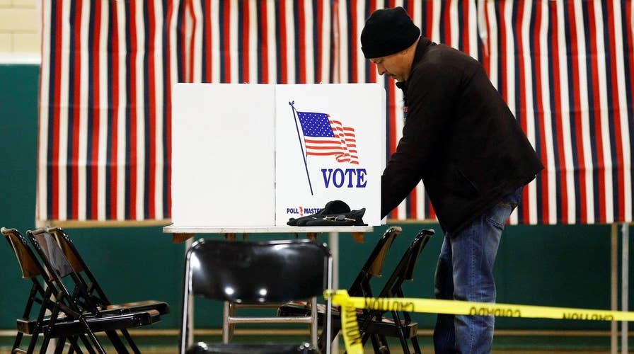 New Hampshire voters head to polls for first primary