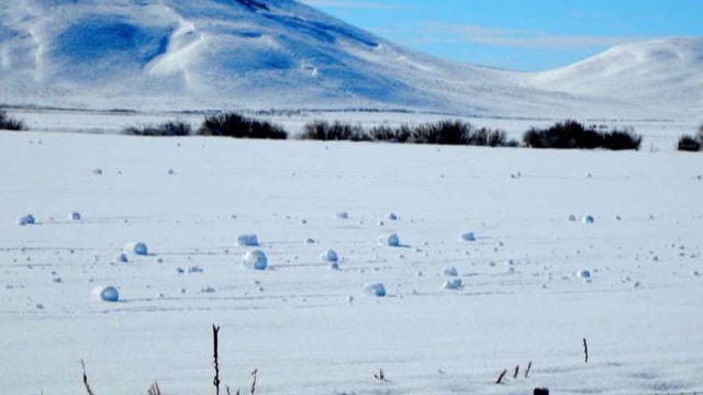 Rare natural phenomenon forms 'snow rollers' in Idaho