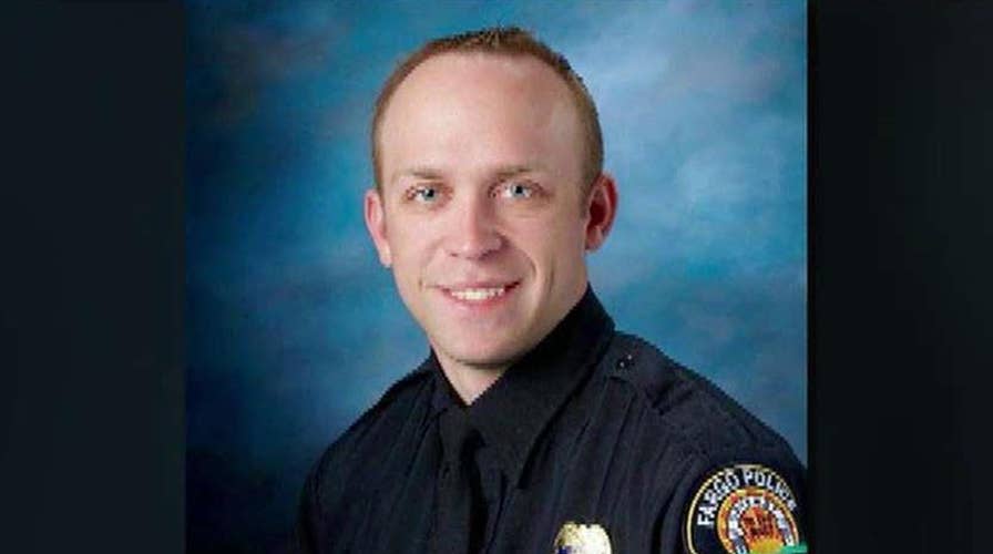Police officer mortally wounded in standoff in Fargo, ND