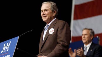 George W. hits the campaign trail, amid taunts from Trump over his legacy