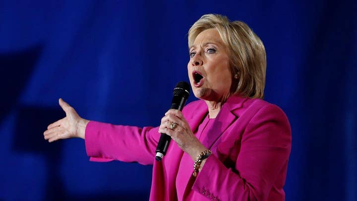 Clinton attempts to launch attack on Sanders, crowd boos