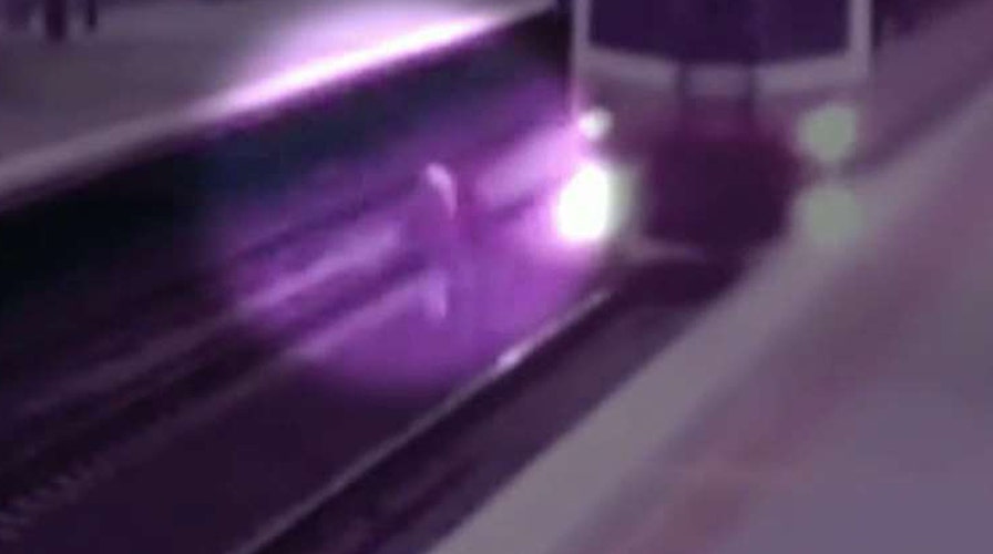 Train in Australia nearly hits man crossing tracks