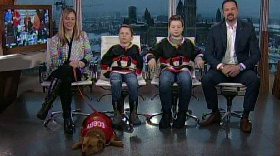 Lucky boys get a puppy after hockey player scores a goal