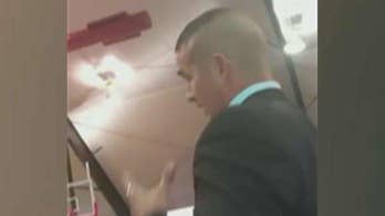 Man claiming to be Marine says Clinton tried to 'cover' up Benghazi, removed from campaign rally