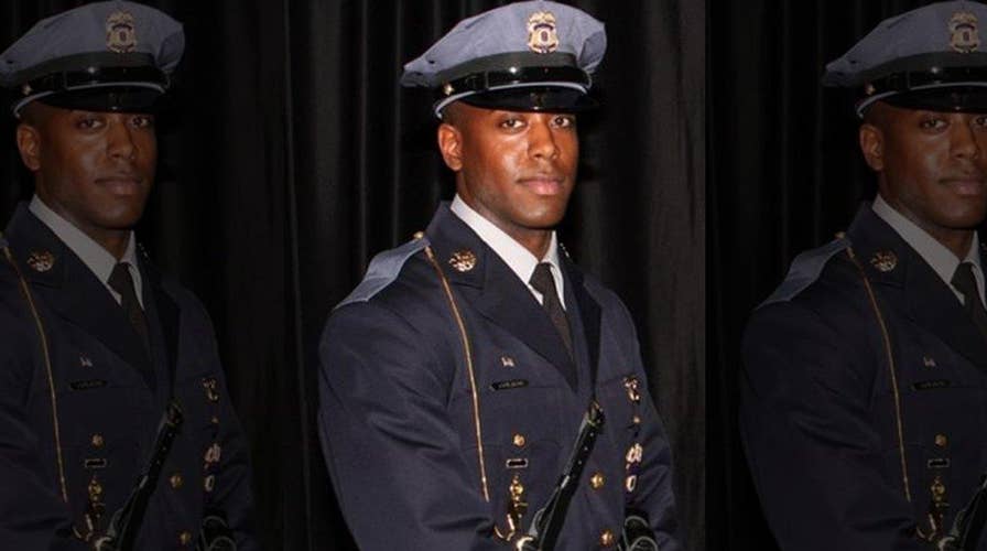Officer gunned down outside of police headquarters