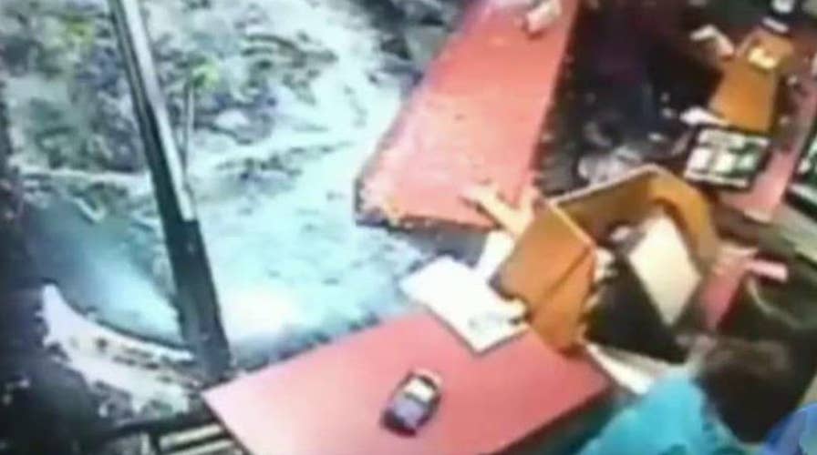 SUV barrels into pizza shop, hits people inside