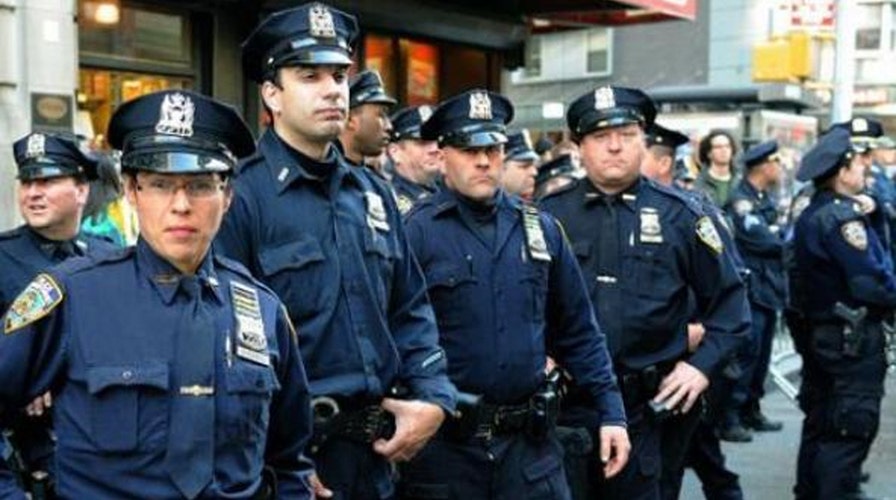 How do white liberals and minorities see cops?