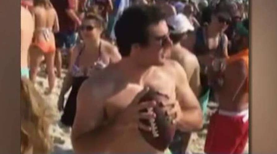 Police send message to partier throwing football at cop car
