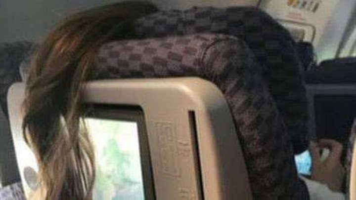 Plane passenger's 'awful' ponytail placement goes viral