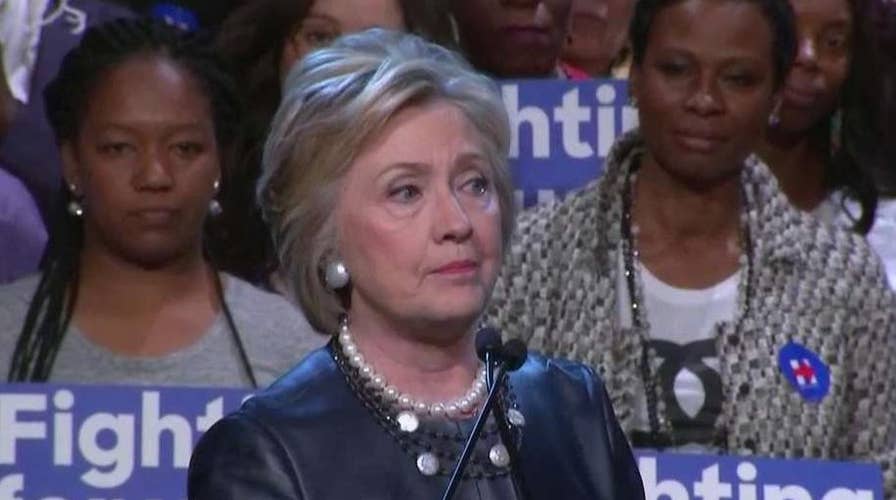 Clinton fights off challenge from Sanders in New York