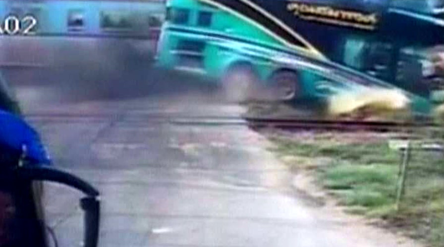 Train smashes into tour bus in deadly crash caught on tape