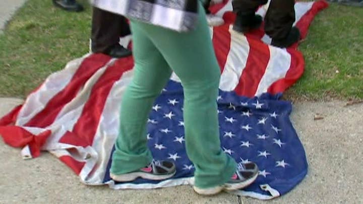 Flag-stomping protesters sparking outrage on campaign trail