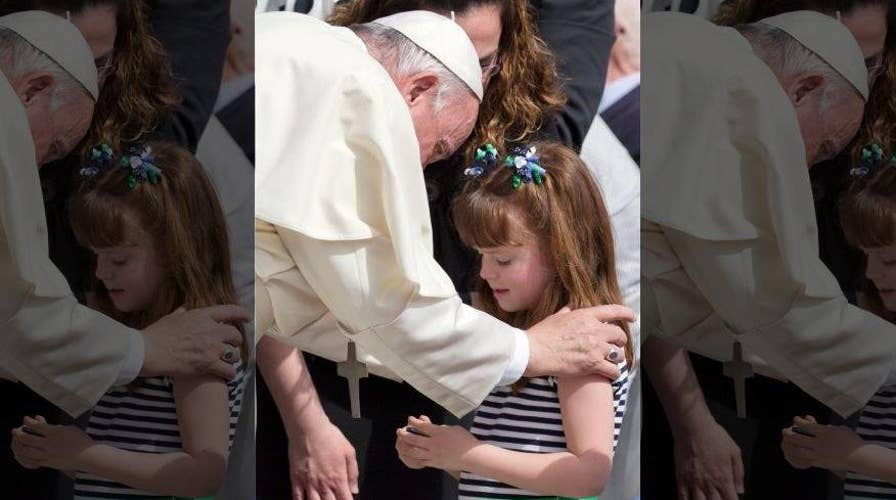 Pope Francis blesses eyes of 5-year-old girl going blind