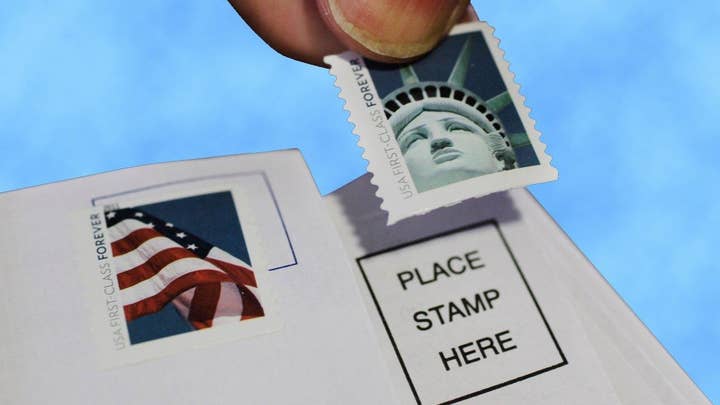 USPS lowers stamp price for first time in 100 years