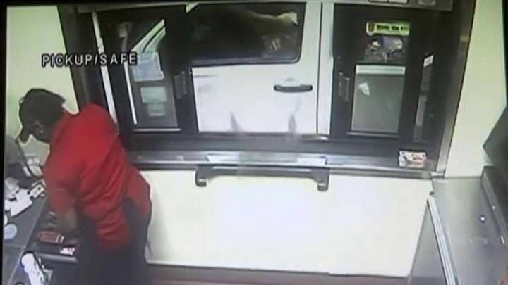 Man tosses live alligator through drive-thru window