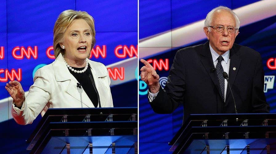 Sparks fly between Clinton and Sanders over minimum wage