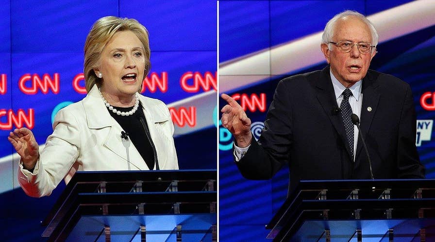 Sparks fly between Clinton and Sanders over minimum wage